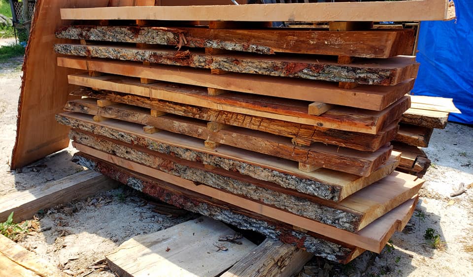 Stickered slabs air-drying in the barn